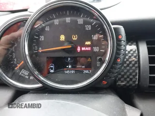 2016 MINI Cooper Hardtop 4 Door S with VIN WMWXU3C58G2D31595, listed as a IAAI auction lot 41267547 with 145,191 mi miles. Bid and sale history available at carsss.com. Image 7.
