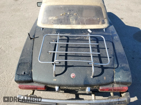 1979 FIAT 124 Spider z VIN 124CS20151060, wystawiony jako Copart lot #78019714 z przebiegiem 95 504 mil mil oraz Czysty tytuł • Clean title. Historia ofert i sprzedaży dostępna na DreamBid. Obrazek 10.