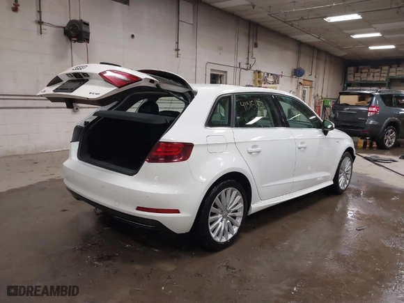 2016 Audi A3 e-tron Premium Plus with VIN WAUTPBFF2GA100666, listed as a IAAI auction lot 41315165 with 98,549 mi miles. Bid and sale history available at carsss.com. Image 4.