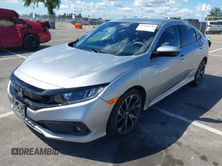2019 Honda Civic Sedan Sport with VIN 2HGFC2F82KH519464, listed as a IAAI auction lot 41940030 with 59,718 mi miles. Bid and sale history available at carsss.com. Image 2.