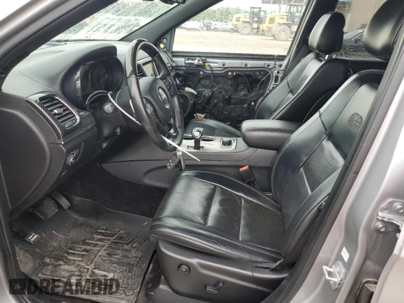 2015 Jeep Grand Cherokee High Altitude with VIN 1C4RJFCG2FC196563, listed as a Copart auction lot 56302315 with 143,759 mi miles and Salvage title. Bid and sale history available at DreamBid. Image 7.