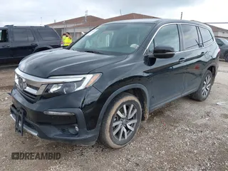 2020 Honda Pilot EX-L with VIN 5FNYF6H57LB059332, listed as a IAAI auction lot 42614422 with 110,279 mi miles and . Bid and sale history available at DreamBid. Image 2.