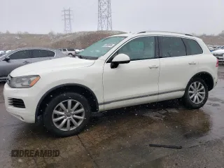 2011 Volkswagen Touareg Sport with VIN WVGFF9BP8BD002982, listed as a Copart auction lot 53958555 with 156,742 mi miles and Salvage Title. Bid and sale history available at DreamBid. Image 1.