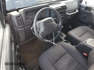 2002 Jeep Wrangler SE with VIN 1J4FA29P82P732805, listed as a Copart auction lot 86017044 with 138,679 mi miles and Salvage Title. Bid and sale history available at DreamBid. Image 8.