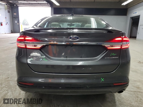 2017 Ford Fusion Titanium z VIN 3FA6P0SU3HR209563, wystawiony jako Copart lot #52039915 z przebiegiem 119 961 mil mil oraz Szkoda całkowita • Salvage title. Historia ofert i sprzedaży dostępna na DreamBid. Obrazek 6.