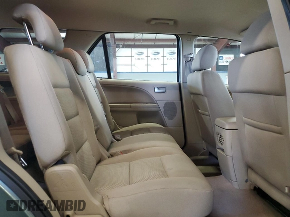 2005 Ford Freestyle SEL z VIN 1FMDK02135GA60009, wystawiony jako Copart lot #52852755 z przebiegiem 248 780 mil mil oraz Szkody całkowita. Historia ofert i sprzedaży dostępna na DreamBid. Obrazek 11.