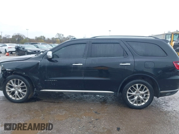 2014 Dodge Durango Citadel with VIN 1C4RDJEG5EC466164, listed as a IAAI auction lot 40936279 with 259,102 mi miles and . Bid and sale history available at DreamBid. Image 14.