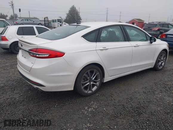 2017 Ford Fusion SE z VIN 3FA6P0H71HR201799, wystawiony jako IAAI lot #41346018 z przebiegiem 51 126 mil mil oraz . Historia ofert i sprzedaży dostępna na DreamBid. Obrazek 4.