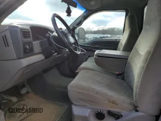 2000 Ford F-250 with VIN 1FTNF21S9YEA14056, listed as a Copart auction lot 80151994 with 165,477 mi miles and Salvage title. Bid and sale history available at DreamBid. Image 7.