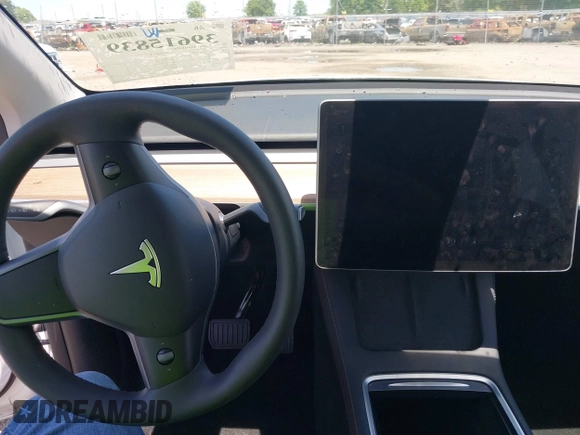 2023 Tesla Model Y Long Range z VIN 7SAYGDEE9PF753051, wystawiony jako IAAI lot #39615839 z przebiegiem Nie podano mil oraz . Historia ofert i sprzedaży dostępna na DreamBid. Obrazek 17.