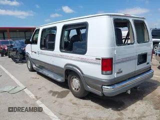 1999 Ford Econoline Cargo Recreational with VIN 1FDRE14L2XHA41059, listed as a IAAI auction lot 42067879 with 149,185 mi miles. Bid and sale history available at carsss.com. Image 3.
