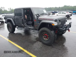 2021 Jeep Gladiator Rubicon z VIN 1C6JJTBG1ML607775, wystawiony jako IAAI lot #42221182 z przebiegiem 34 172 mil mil oraz . Historia ofert i sprzedaży dostępna na DreamBid. Obrazek 1.