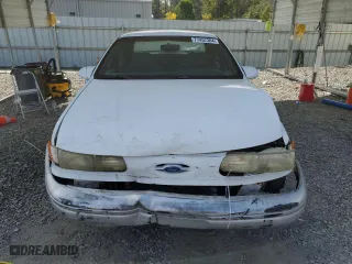 1992 Ford Taurus GL with VIN 1FALP52U5NA280821, listed as a Copart auction lot 77457304 with 33,484 mi miles and Salvage Title. Bid and sale history available at carsss.com. Image 5.