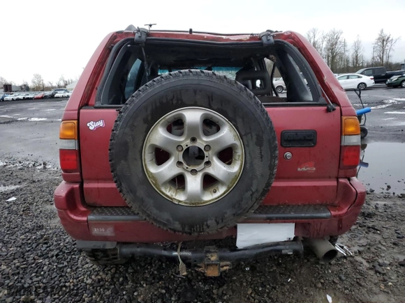 1998 Isuzu Rodeo S with VIN 4S2CM58W5W4350575, listed as a Copart auction lot 84537714 with 215,573 mi miles and Salvage Title. Bid and sale history available at carsss.com. Image 6.