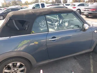 2010 MINI Convertible with VIN WMWMR3C53ATU97865, listed as a IAAI auction lot 41610670 with 154,457 mi miles and . Bid and sale history available at DreamBid. Image 6.