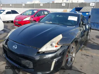 2014 Nissan 370Z Touring with VIN JN1AZ4EH1EM631097, listed as a IAAI auction lot 41230197 with 85,304 mi miles. Bid and sale history available at carsss.com. Image 6.