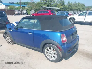 2013 MINI Convertible S with VIN WMWZP3C5XDT705613, listed as a IAAI auction lot 42392748 with 87,477 mi miles and . Bid and sale history available at DreamBid. Image 3.