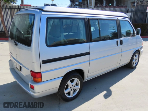 2003 Volkswagen EuroVan MV с VIN WV2NB47003H003033, выставлен на аукционе Copart как лот 47059195 с пробегом 164 173 миль миль и Чистый • Clean title. История ставок и продаж доступна на DreamBid. Изображение 3.