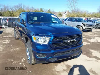 2022 Ram 1500 Big Horn z VIN 1C6RRFMG4NN438867, wystawiony jako IAAI lot #41704632 z przebiegiem 22 125 mil mil oraz . Historia ofert i sprzedaży dostępna na DreamBid. Obrazek 1.