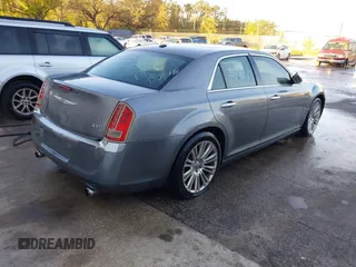 2011 Chrysler 300 with VIN 2C3CA6CTXBH580203, listed as a IAAI auction lot 41751968 with 173,916 mi miles. Bid and sale history available at carsss.com. Image 4.