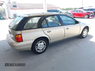 1997 Saturn SW z VIN 1G8ZK8277VZ368280, wystawiony jako IAAI lot #42269973 z przebiegiem 159 404 mil mil oraz . Historia ofert i sprzedaży dostępna na DreamBid. Obrazek 4.