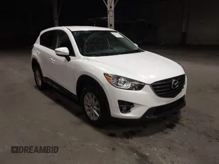 2016 Mazda CX-5 Touring with VIN JM3KE4CY0G0853261, listed as a IAAI auction lot 41861176 with 63,491 mi miles. Bid and sale history available at carsss.com. Image 1.