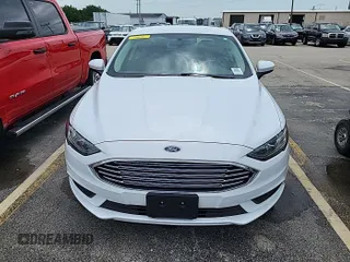 2017 Ford Fusion SE z VIN 3FA6P0H73HR319658, wystawiony jako IAAI lot #42806844 z przebiegiem 76 939 mil mil oraz . Historia ofert i sprzedaży dostępna na DreamBid. Obrazek 6.