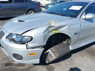 2005 Pontiac GTO with VIN 6G2VX12U05L369686, listed as a IAAI auction lot 41975716 with 64,893 mi miles. Bid and sale history available at carsss.com. Image 6.
