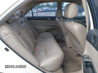 2002 Toyota Camry XLE z VIN 4T1BF30K72U500934, wystawiony jako IAAI lot #42312967 z przebiegiem 169 569 mil mil oraz . Historia ofert i sprzedaży dostępna na DreamBid. Obrazek 8.