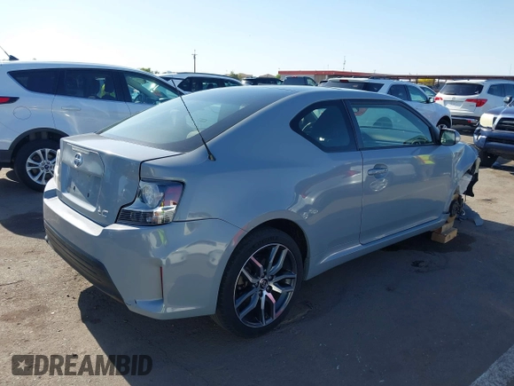 2015 Scion tC with VIN JTKJF5C7XFJ012872, listed as a IAAI auction lot 42128621 with 100,832 mi miles. Bid and sale history available at carsss.com. Image 4.