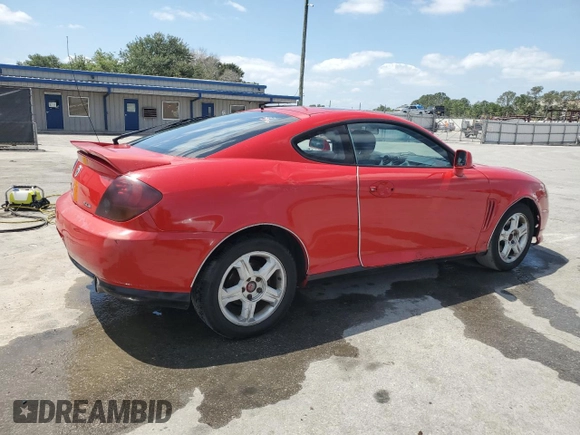 2003 Hyundai Tiburon GT z VIN KMHHN65F33U088538, wystawiony jako Copart lot #54320955 z przebiegiem 220 732 mil mil oraz Szkoda całkowita • Salvage title. Historia ofert i sprzedaży dostępna na DreamBid. Obrazek 3.