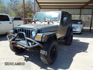 2005 Jeep Wrangler Sport with VIN 1J4FA49S45P345673, listed as a IAAI auction lot 41830128 with 139,432 mi miles. Bid and sale history available at carsss.com. Image 17.