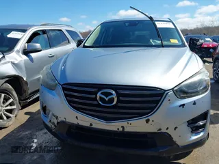 2016 Mazda CX-5 Grand Touring with VIN JM3KE4DY9G0795360, listed as a IAAI auction lot 41933991 with 176,373 mi miles. Bid and sale history available at carsss.com. Image 12.
