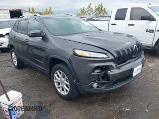 2014 Jeep Cherokee Altitude with VIN 1C4PJMCB7EW232678, listed as a IAAI auction lot 40812147 with 105,828 mi miles. Bid and sale history available at carsss.com. Image 1.