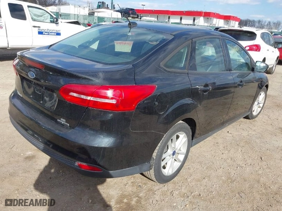 2015 Ford Focus SE with VIN 1FADP3F20FL296173, listed as a IAAI auction lot 41899632 with 136,572 mi miles. Bid and sale history available at carsss.com. Image 4.