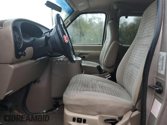 2001 Ford Econoline Passenger XL with VIN 1FBSS31LX1HA23564, listed as a Copart auction lot 77703044 with 276,538 mi miles and Salvage title. Bid and sale history available at DreamBid. Image 7.