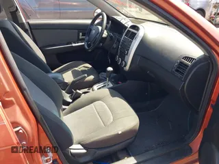 2009 Kia Spectra EX with VIN KNAFE221195026956, listed as a IAAI auction lot 42019309 with 121,341 mi miles. Bid and sale history available at carsss.com. Image 5.