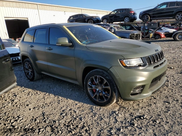 2021 Jeep Grand Cherokee SRT with VIN 1C4RJFDJ5MC718125, listed as a Copart auction lot 88736945 with 54,553 mi miles and Salvage Title. Bid and sale history available at carsss.com. Image 4.