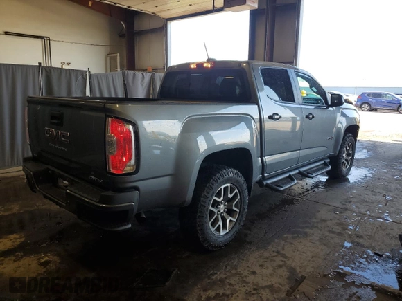 2022 GMC Canyon 4WD AT4 z VIN 1GTG6FEN0N1162393, wystawiony jako Copart lot #55286065 z przebiegiem 55 185 mil mil oraz Szkoda całkowita • Salvage title. Historia ofert i sprzedaży dostępna na DreamBid. Obrazek 3.