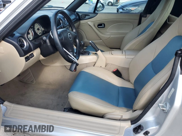2003 Mazda MX-5 Miata Cloth with VIN JM1NB353230312510, listed as a Copart auction lot 54925895 with 141,391 mi miles and Salvage Title. Bid and sale history available at DreamBid. Image 7.