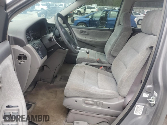 2000 Honda Odyssey EX with VIN 2HKRL1865YH513885, listed as a Copart auction lot 50223505 with 214,627 mi miles and Salvage Title. Bid and sale history available at DreamBid. Image 7.