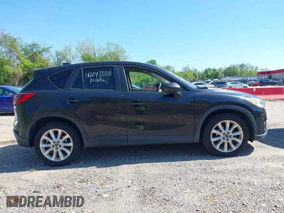 2013 Mazda CX-5 Grand Touring with VIN JM3KE4DE6D0127601, listed as a IAAI auction lot 42143558 with 95,719 mi miles and . Bid and sale history available at DreamBid. Image 13.