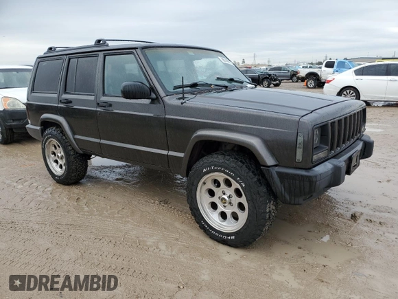 1999 Jeep Cherokee Sport with VIN 1J4FT68S2XL656679, listed as a Copart auction lot 88145875 with 254,038 mi miles and Salvage title. Bid and sale history available at DreamBid. Image 4.