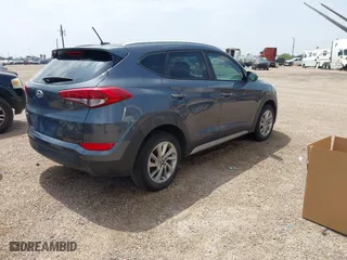 2017 Hyundai Tucson SE Plus with VIN KM8J33A42HU375273, listed as a IAAI auction lot 41900474 with 124,658 mi miles. Bid and sale history available at carsss.com. Image 4.