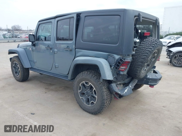 2015 Jeep Wrangler Unlimited Rubicon Hard Rock z VIN 1C4HJWFG1FL679873, wystawiony jako IAAI lot #41508722 z przebiegiem 97 165 mil mil oraz . Historia ofert i sprzedaży dostępna na DreamBid. Obrazek 3.