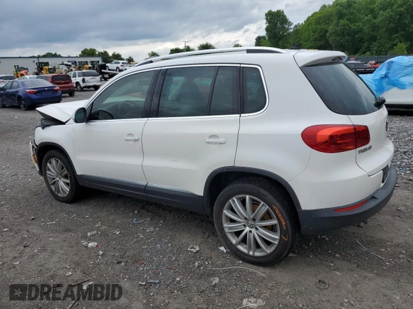 2014 Volkswagen Tiguan SE z VIN WVGAV3AX5EW551477, wystawiony jako Copart lot #55773245 z przebiegiem 153 437 mil mil oraz Czysty tytuł • Clean title. Historia ofert i sprzedaży dostępna na DreamBid. Obrazek 2.