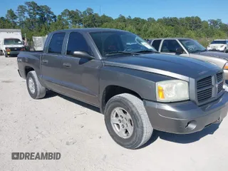 2006 Dodge Dakota SLT with VIN 1D7HW48N96S689743, listed as a IAAI auction lot 42055069 with 258,621 mi miles. Bid and sale history available at carsss.com. Image 1.