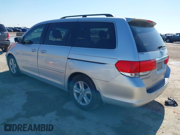 2010 Honda Odyssey Touring with VIN 5FNRL3H97AB015472, listed as a IAAI auction lot 41763680 with 144,309 mi miles. Bid and sale history available at carsss.com. Image 3.