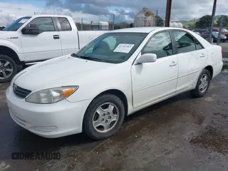 2002 Toyota Camry XLE z VIN 4T1BF30KX2U035422, wystawiony jako IAAI lot #41762363 z przebiegiem 220 465 mil mil oraz . Historia ofert i sprzedaży dostępna na DreamBid. Obrazek 17.