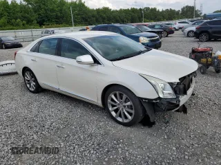 2013 Cadillac XTS Luxury with VIN 2G61P5S33D9125769, listed as a Copart auction lot 59671015 with 143,583 mi miles and Salvage title. Bid and sale history available at DreamBid. Image 4.